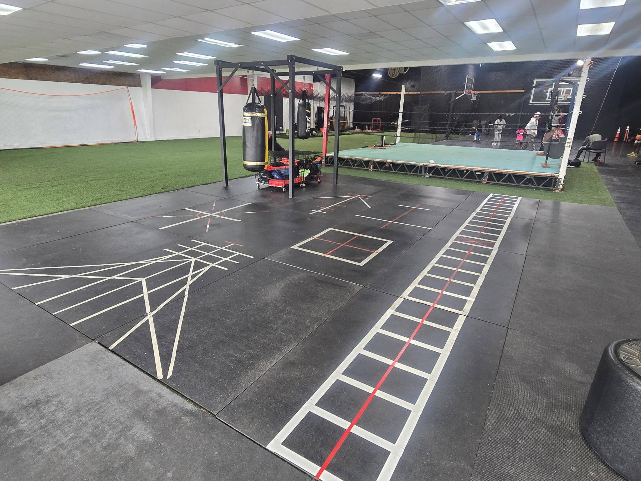 Tribe members doing core and functional training conditioning work on the mats